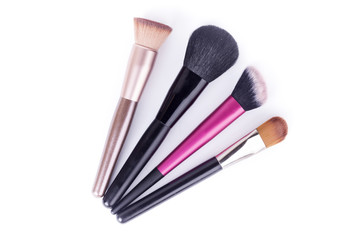 Set of makeup brushes isolated on white background closeup