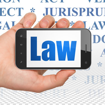 Law concept: Hand Holding Smartphone with Law on display