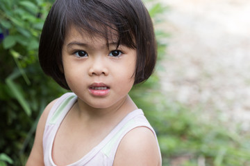 Closeup adorable face little asian girl.