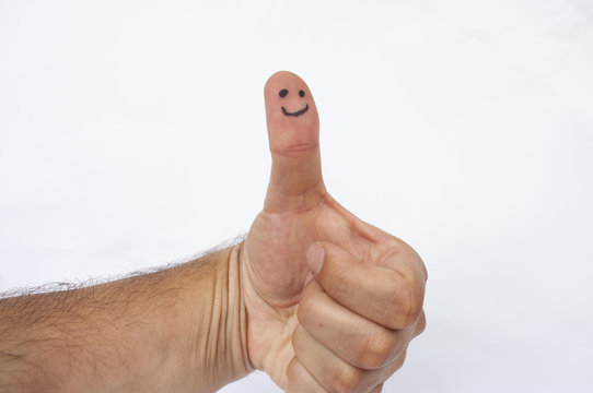 Happy face on finger