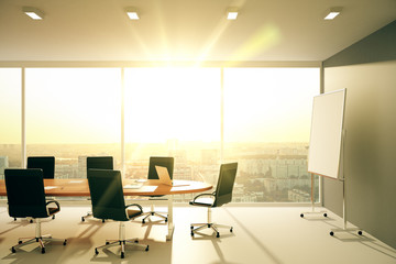 Modern conference room with furniture and city view at sunrise