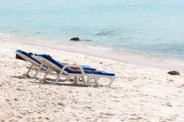 Fototapeta na wymiar Chairs on a beautiful beach