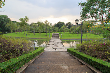 Beautiful stone bridge across the lake in Sirikit park Bangkok Thailand