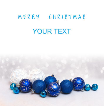Merry Christmas card with blue balls and a free place