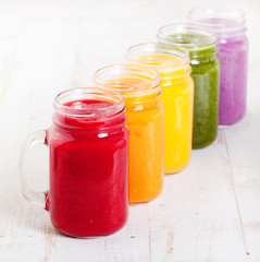 Smoothies, juices, beverages, drinks variety with fresh fruits and berries .