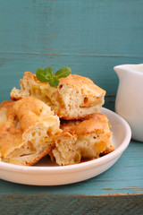 homemade apple pie (charlotte) on a blue wooden background