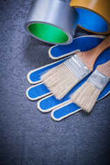 Set of household tape paint brushes safety gloves construction c
