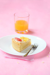 Piece of Coconut Tart with Fresh Grapefruit and Pineapple Gummies