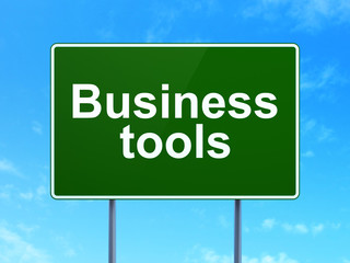 Finance concept: Business Tools on road sign background
