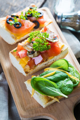 Italian appetizers, bruschetta with cheese and vegetables