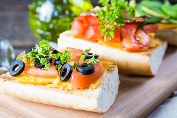 Italian appetizers, bruschetta with cheese and vegetables