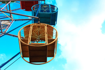 Close-Up Ferris Wheel Over Blue Sky