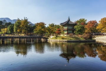 hyangwonjeong autumn reflections and fall colors with lake reflections of the leaves surrounding the pavilion. Taken in Gyeongbokgung, South Korea. 