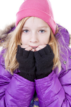 Teenage girl is posing in winter outfit over white backgroung