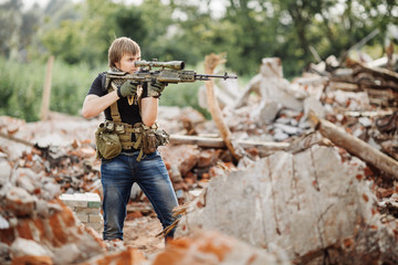 Private Military Contractor on patrol in destroyed city