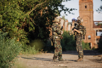 two rangers talking and drinking water
