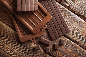 Chocolate on wooden wall background