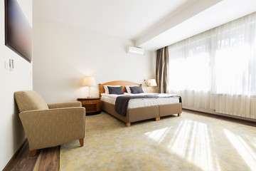 Interior of a hotel bedroom in the morning - sunlight