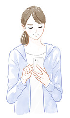 スマートフォンを操作する女性