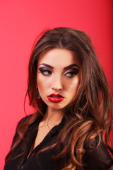 Glamour portrait of young and attractive woman with makeup and r