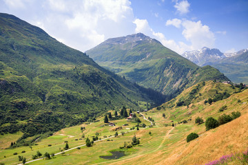 Alpine valley with golf fields. Summertime in Switzerland