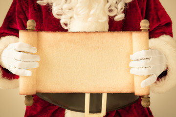 Santa Claus holding scroll paper blank