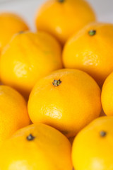 Bunch of fresh mandarin oranges on market.