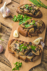 Mushroom mixture on rustic toast with garlic