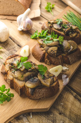 Mushroom mixture on rustic toast with garlic