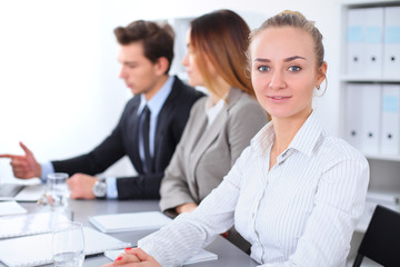 Obraz premium Group of Business people at meeting, focus on blond business woman