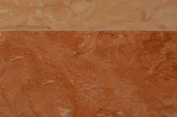 Blurry brown tile texture with small stains