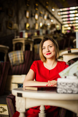 pretty young woman sitting in the cafe