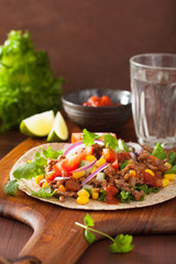 mexican taco with beef tomato salsa onion corn