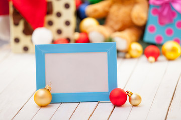 Naklejka na ściany i meble Photo frame with christmas gifts