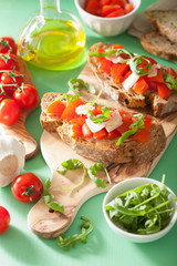 italian bruschetta with tomatoes parmesan arugula