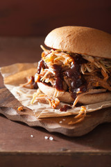 homemade pulled pork burger with coleslaw and bbq sauce © Olga Miltsova