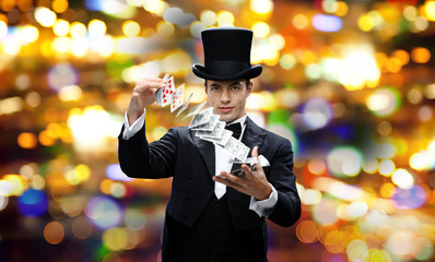 magician showing trick with playing cards