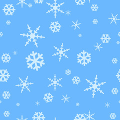 Seamless blue background with falling snowflakes