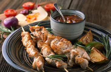 Chicken skewers grilled with sauce