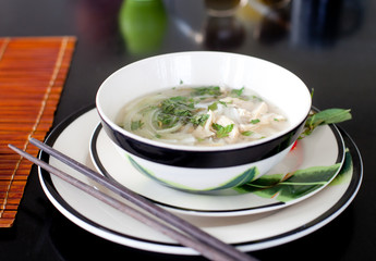 Traditional Vietnamese beef soup pho . Wooden background