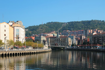 Fototapeta na wymiar Nervion river, city hall building. Bilbao, Spain