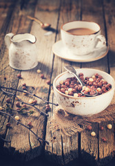 Obraz na płótnie Canvas Delicious chocolate corn balls in milk. Assorted.Healthy Breakfast.selective focusToned image. Vintage style.