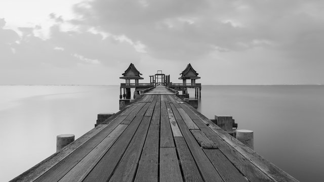 Fototapeta Black and white of temple wooden bridge in the sea port