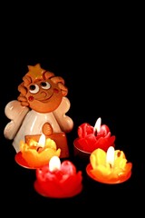 Christmas theme - ceramic angel and four burning candles