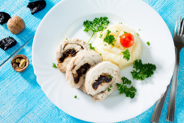 Chicken roll with prunes and nuts in a rustic style
