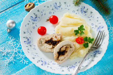 Chicken roll with prunes and nuts in a New Year's Eve