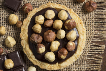 Chocolate and caramel tarts with hazelnuts