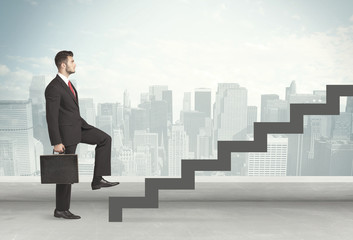 Business person in front of a staircase