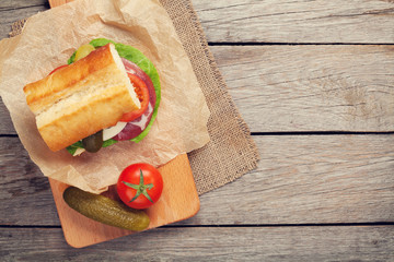 Sandwich with salad, ham, cheese and tomatoes