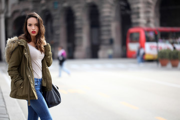 Fototapeta premium Beautiful girl at the bus stop